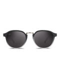 Occhiali da sole Bloom di TWIG Concept Milano - occhiali da sole tondi neri unisex con lenti scure, ponte sottile e metallico e montatura in policarbonato con protezione UV 400. Visualizzati su sfondo bianco.
