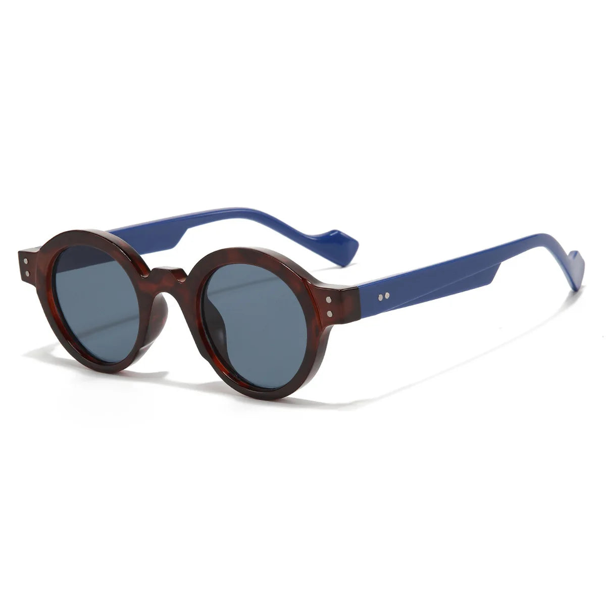 Occhiali da Sole Rotondi punk Retrò UV400 di PACOSHOP24.COM con lenti scure, montatura tartarugata e aste blu spesse, presentati su sfondo bianco.