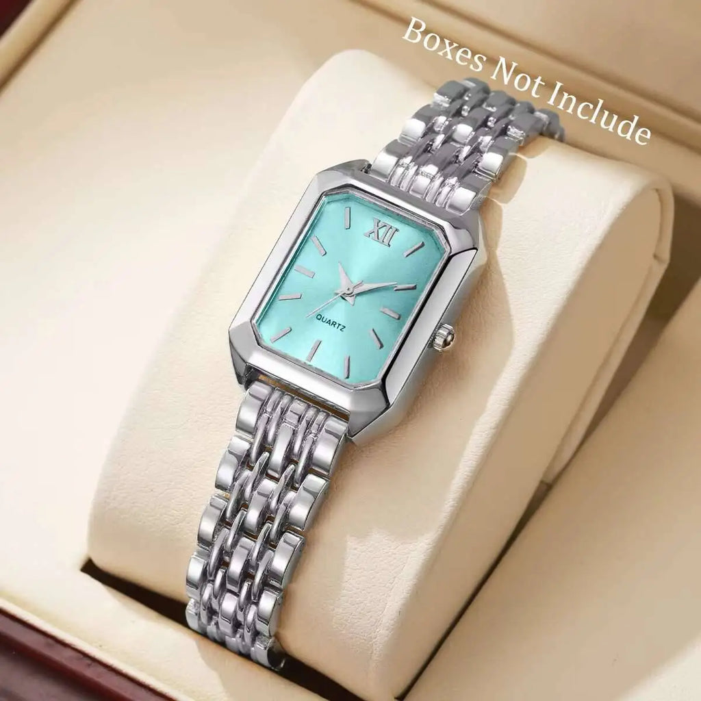 Orologio in argento PACOSHOP24.COM al quarzo donna rettangolare alla moda con quadrante turchese e numero romano XII, su cuscino color crema. Testo nell'angolo: Scatole non incluse.