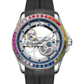 L'Orologio Automatico Skeleton Tourbillon Uomo di PACOSHOP24.COM presenta un movimento meccanico a vista, un elegante design in acciaio inossidabile, un cinturino nero, un quadrante scheletrato trasparente e una lunetta con pietre preziose arcobaleno: un pezzo esclusivo per i collezionisti.