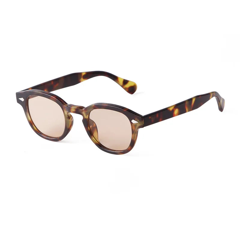 PACOSHOP24.COM Occhiali da sole vintage fashion retrò rotondi Unisex in policarbonato, con motivo tartarugato, lenti marroni tonde e aste spesse curve, esposti su sfondo bianco.