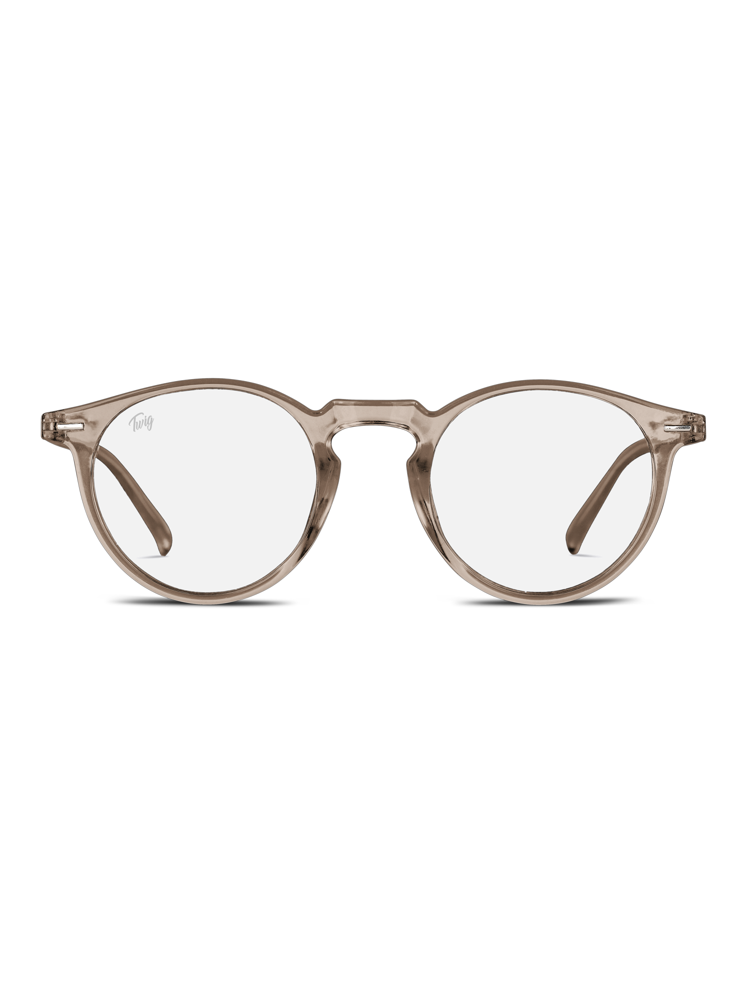 Gli Occhiali luce blu Watson di TWIG Concept Milano sono occhiali tondi trasparenti con montatura marrone chiaro, lenti trasparenti e accenti dorati sulla cerniera: questi occhiali da computer riducono lo stress visivo e sono raffigurati su uno sfondo bianco.