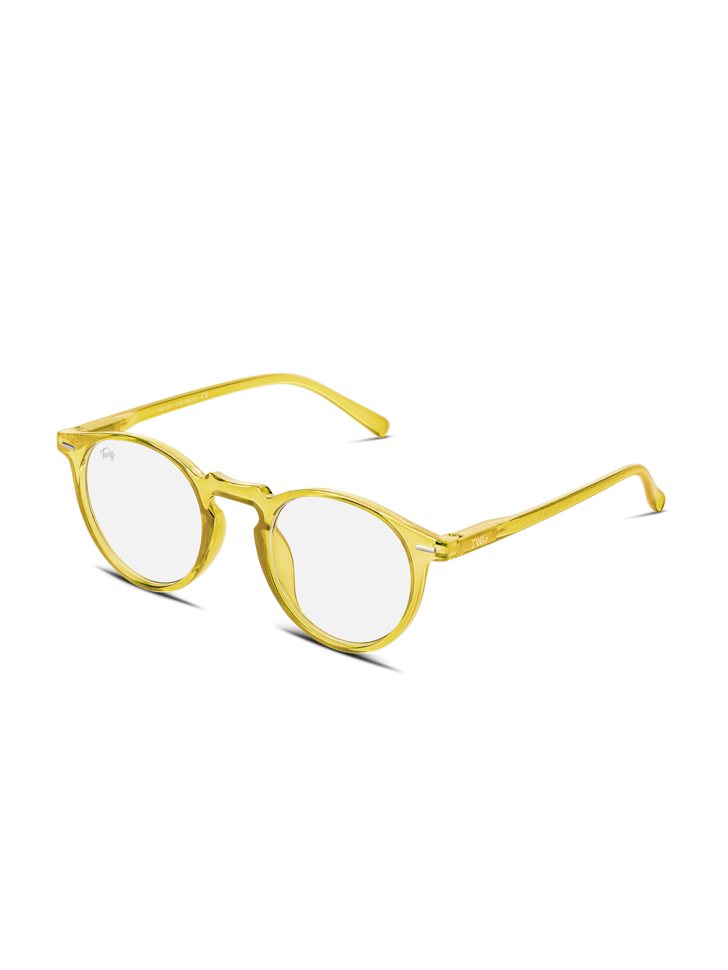 Gli Occhiali luce blu Watson di TWIG Concept Milano sono occhiali rotondi con lenti chiare e montatura gialla traslucida, pensati per l'uso del computer per ridurre l'affaticamento degli occhi, su sfondo bianco.