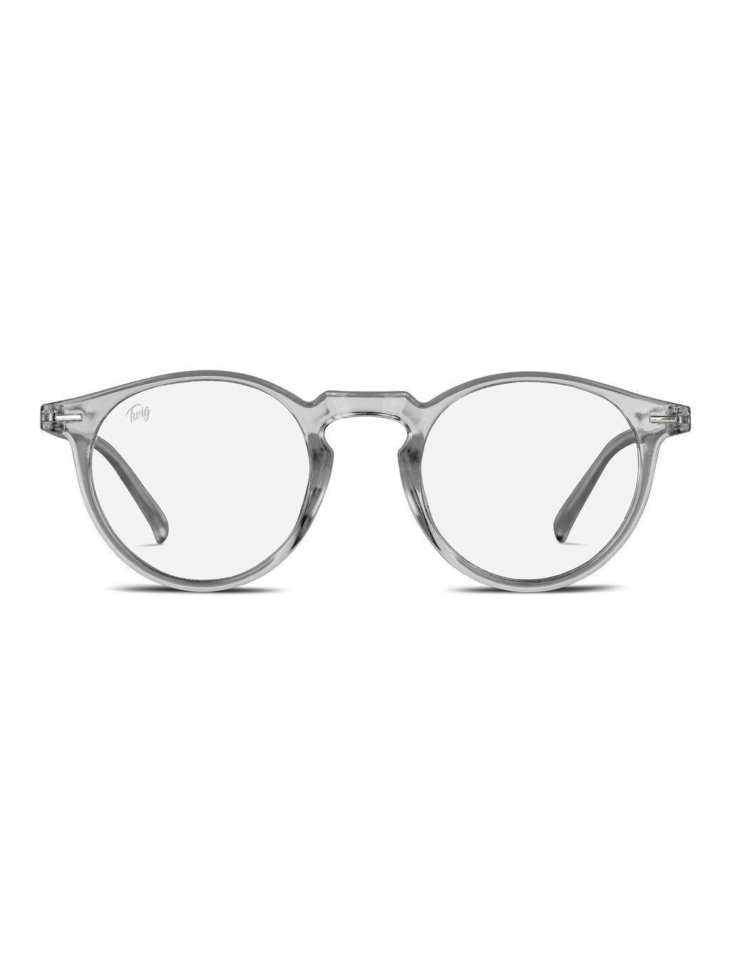 Occhiali luce blu Watson di TWIG Concept Milano: occhiali chiari e rotondi a luce blu con montatura trasparente e stanghette sottili, progettati per ridurre lo stress visivo. Mostrati su un semplice sfondo bianco.