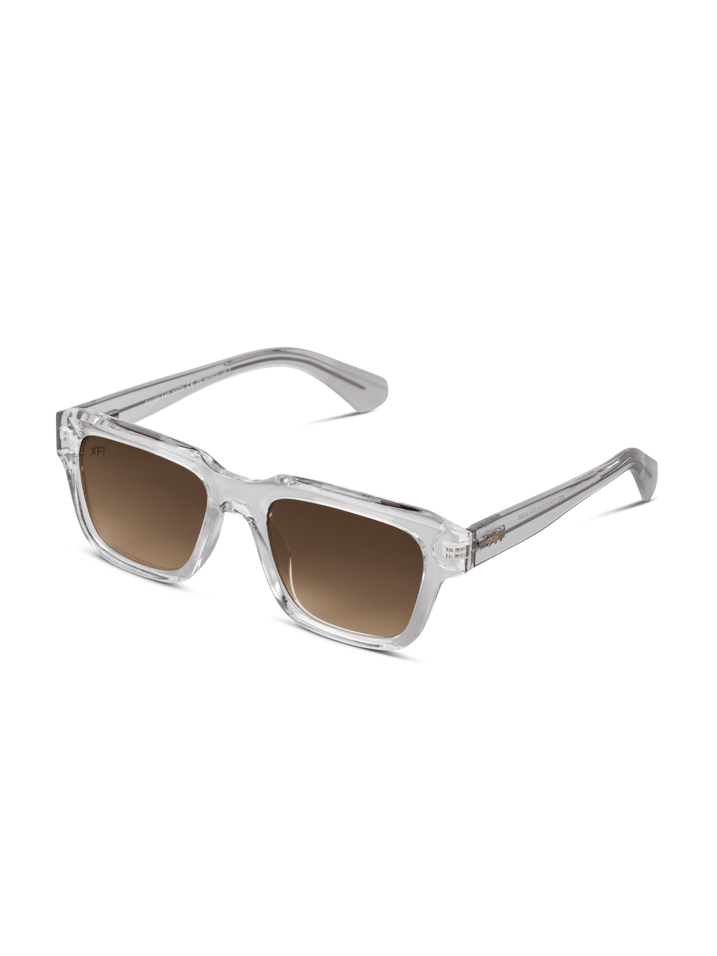 Gli occhiali da sole Crystalith di X Frame Therapy sono caratterizzati da una montatura rettangolare chiara in acetato di cellulosa, lenti color marrone e aste spesse e dritte per un look moderno e unisex. Visualizzati su uno sfondo bianco.