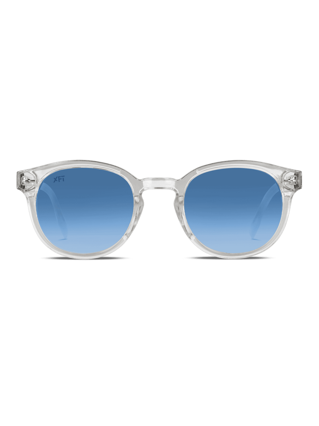 I Luminatrix di X Frame Therapy sono occhiali da sole rotondi unisex con montatura chiara e lenti blu sfumate con protezione UV, su sfondo bianco.