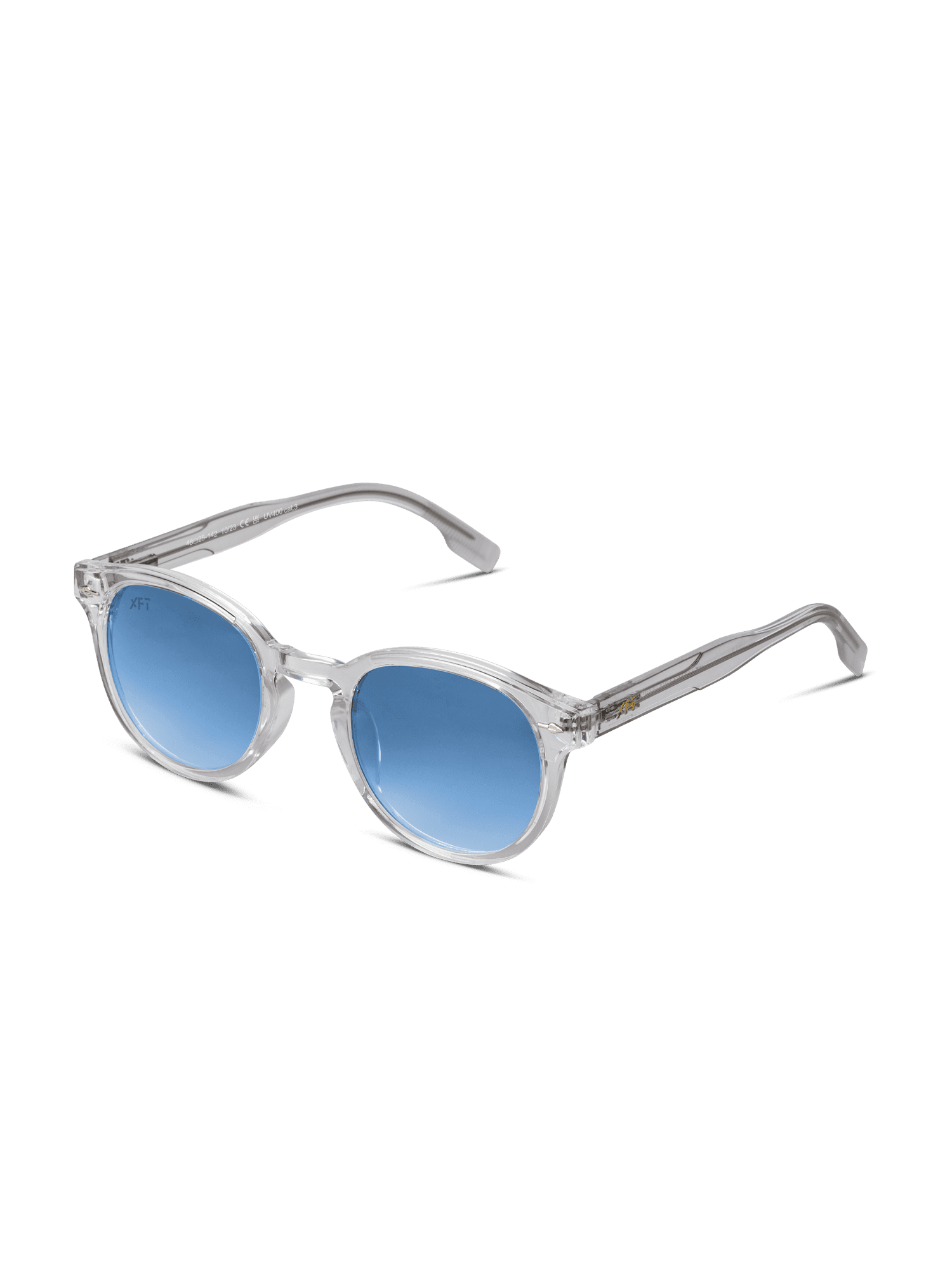 Luminatrix di X Frame Therapy è caratterizzato da montatura trasparente, lenti rotonde blu con protezione UV e stanghette trasparenti. Su sfondo bianco, questi occhiali da sole unisex offrono un look moderno ed elegante.