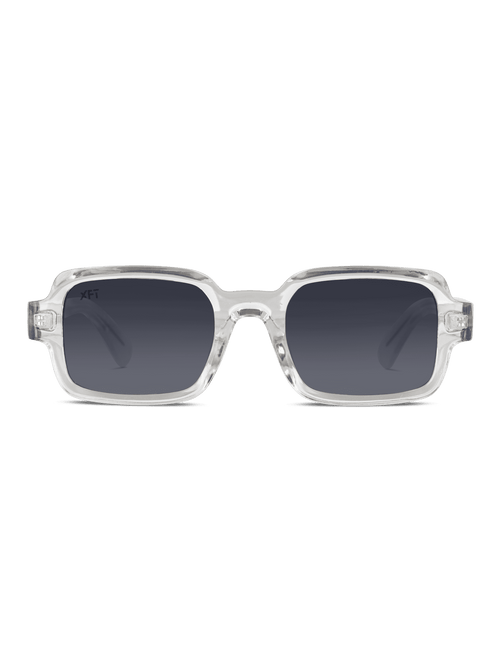I Neocraft di X Frame Therapy sono occhiali da sole rettangolari unisex con montatura in plastica spessa e trasparente e lenti scure sfumate con protezione UV400, su sfondo bianco.
